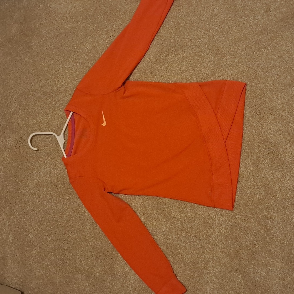 This is a Nike youth sweatshirt, size 6-7. Color: Orange